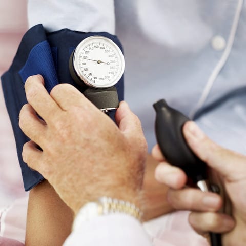 State College - Pair of Human Hands Checking the Blood Pressure of a Patient