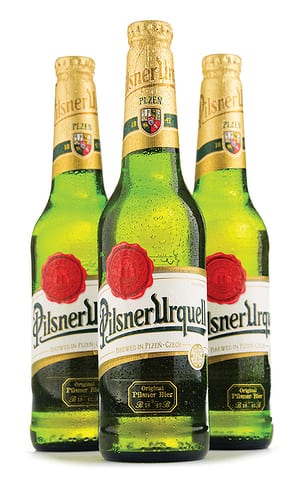 State College - Bottles of Pilsner Urquell beer over white
