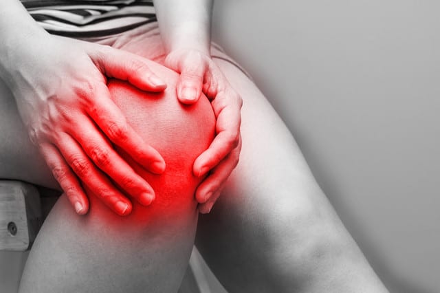State College - Soft focus of asian women to knee injury