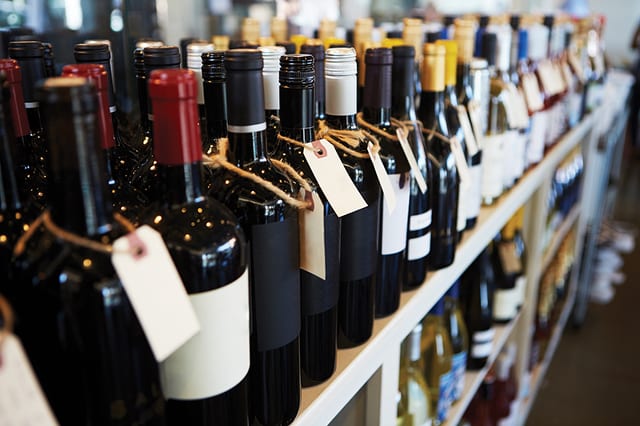 State College - Bottles Of Wine On Display In Delicatessen