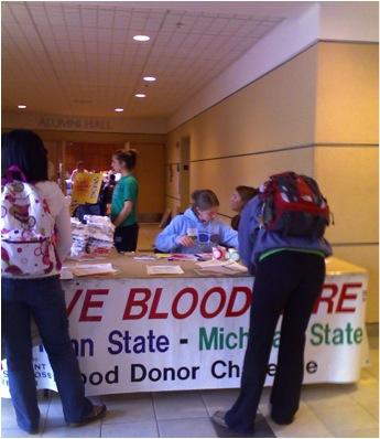 State College - Student volunteers Melissa McCormack and Kyle Brown stand outside the HUB Nov. 18|Students sign up to give blood, outside the HUB Alumni Hall. Nov. 18
