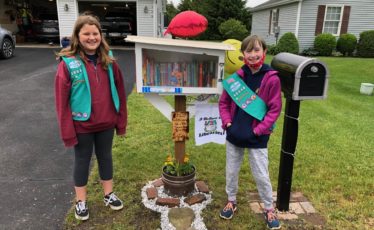 10-year-old girls provide Free Little Library