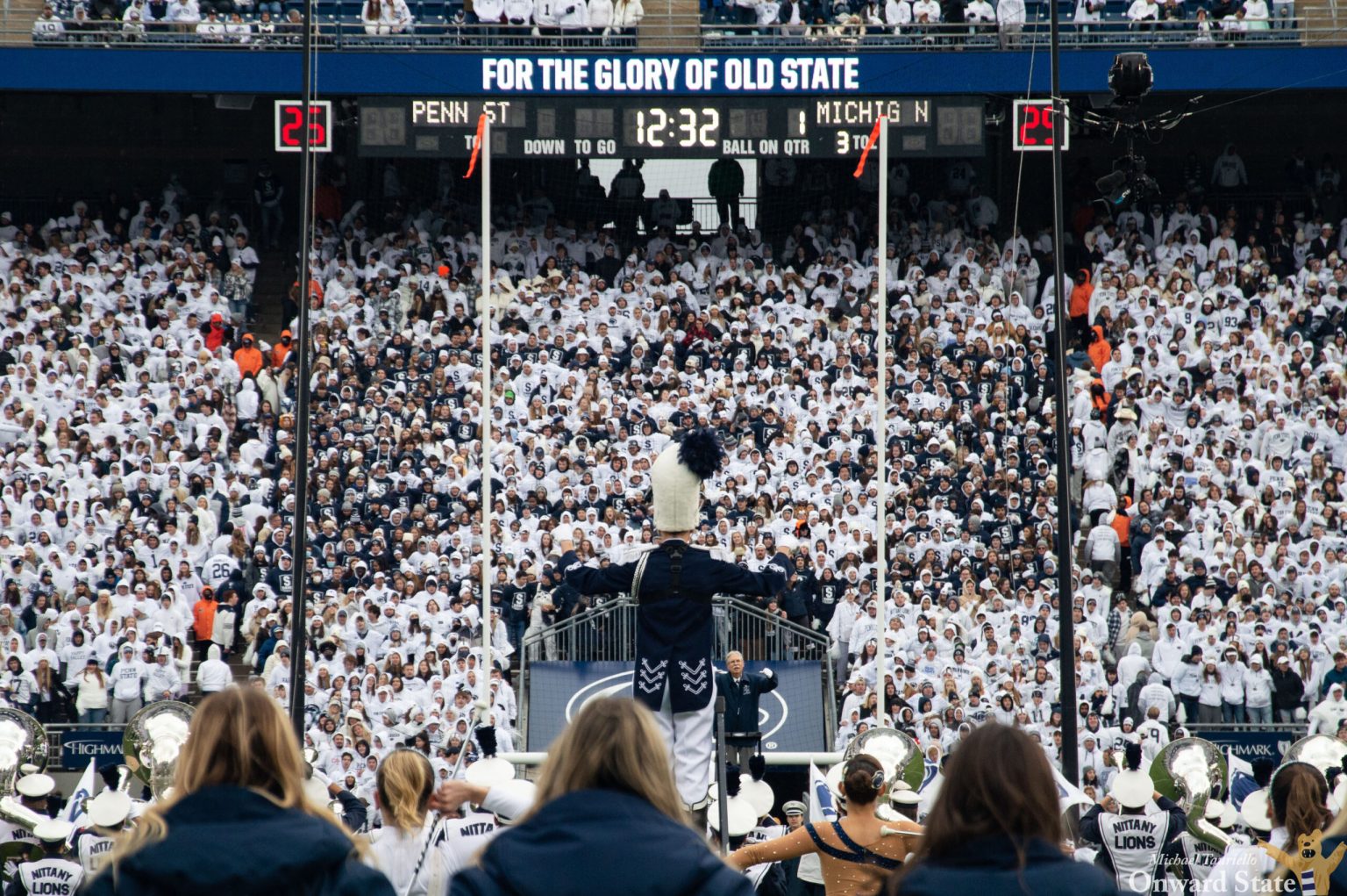 Penn State Blue Band drum major leads the band in front of the student section at Penn State football's Beaver Stadium