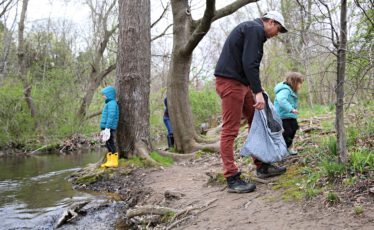 VOLUNTEERS PICK UP trash along a stream in Centre County on April 23 during ClearWater Conservancy’s 26th Annual Watershed Cleanup Day.