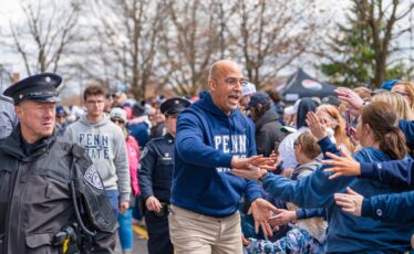 Penn State coach James Franklin greets fans during the team arrival outside Beaver Stadium before the Blue-White Game on April 13, 2024. Photo by Giovanna Lee | Onward State
