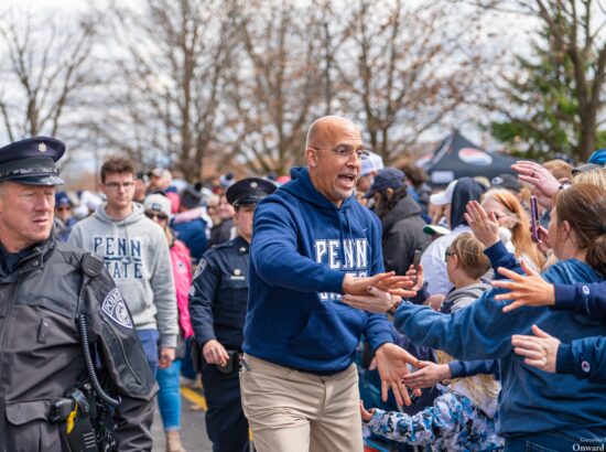 Penn State coach James Franklin greets fans during the team arrival outside Beaver Stadium before the Blue-White Game on April 13, 2024. Photo by Giovanna Lee | Onward State