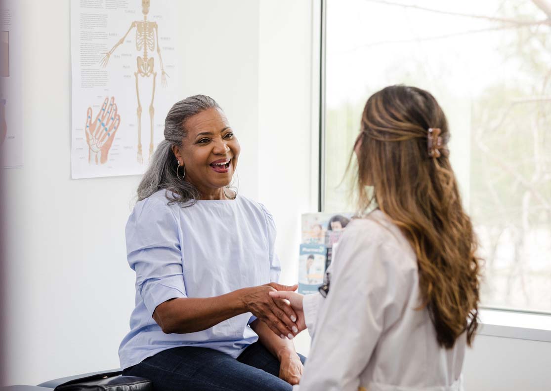 State College - Female patient shakes hands with the female healthcare professional