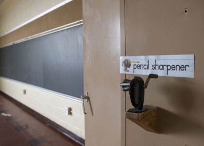 A pencil sharpener and blackboard are pictured in former classroom inside of NuMedX Medical Clinic, formerly Longview Elementary School in Punxsutawney, Pa., on April 5, 2023.