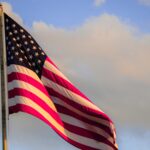 State College - american flag meadow-marie-eQ1xDfI79f0-unsplash