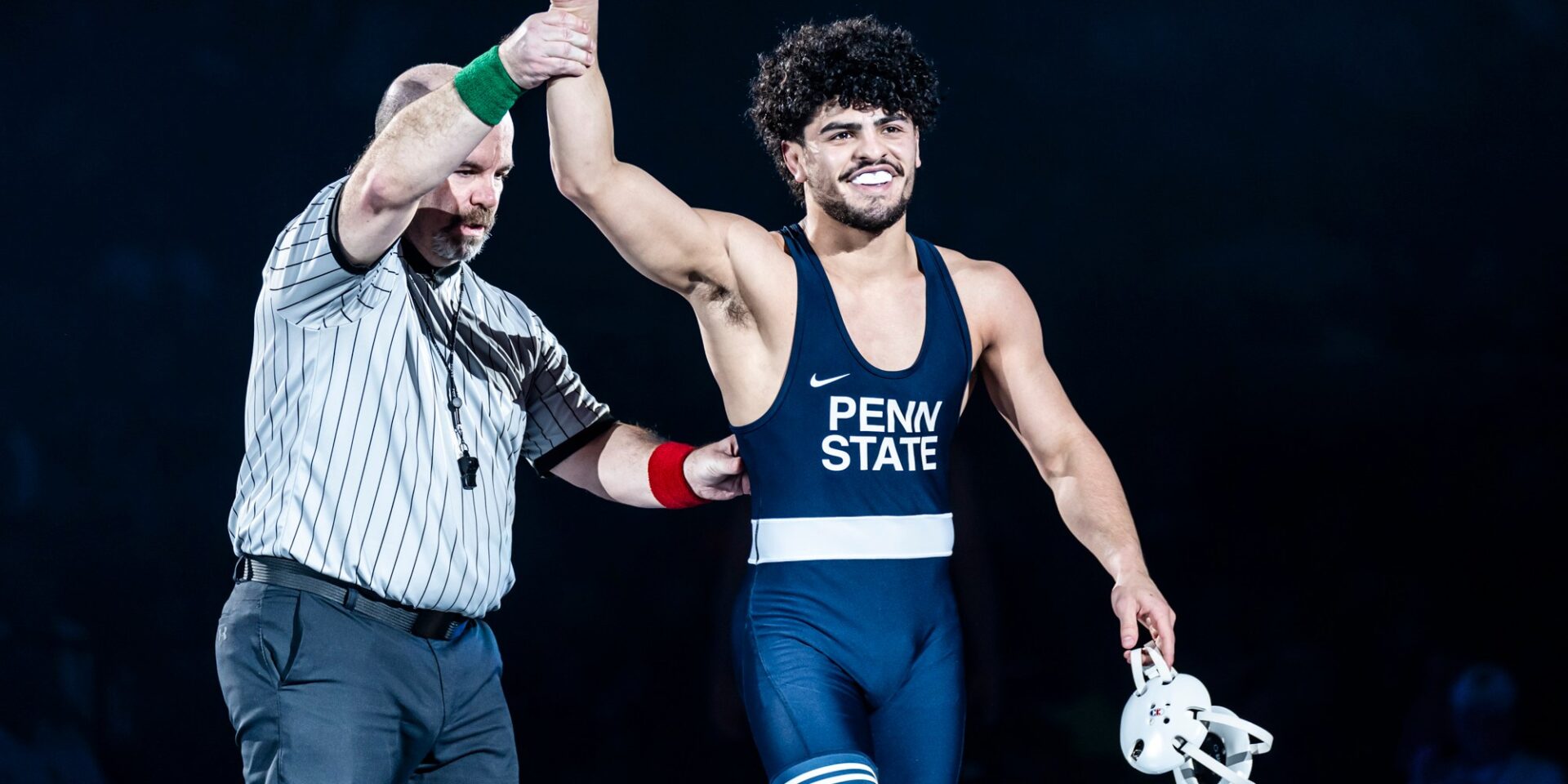 Penn State 141-pound wrestler Beau Bartlett's arm is raised after a pin of Wyoming's Cole Brooks on Sunday, Dec. 15, at the Bryce Jordan Center