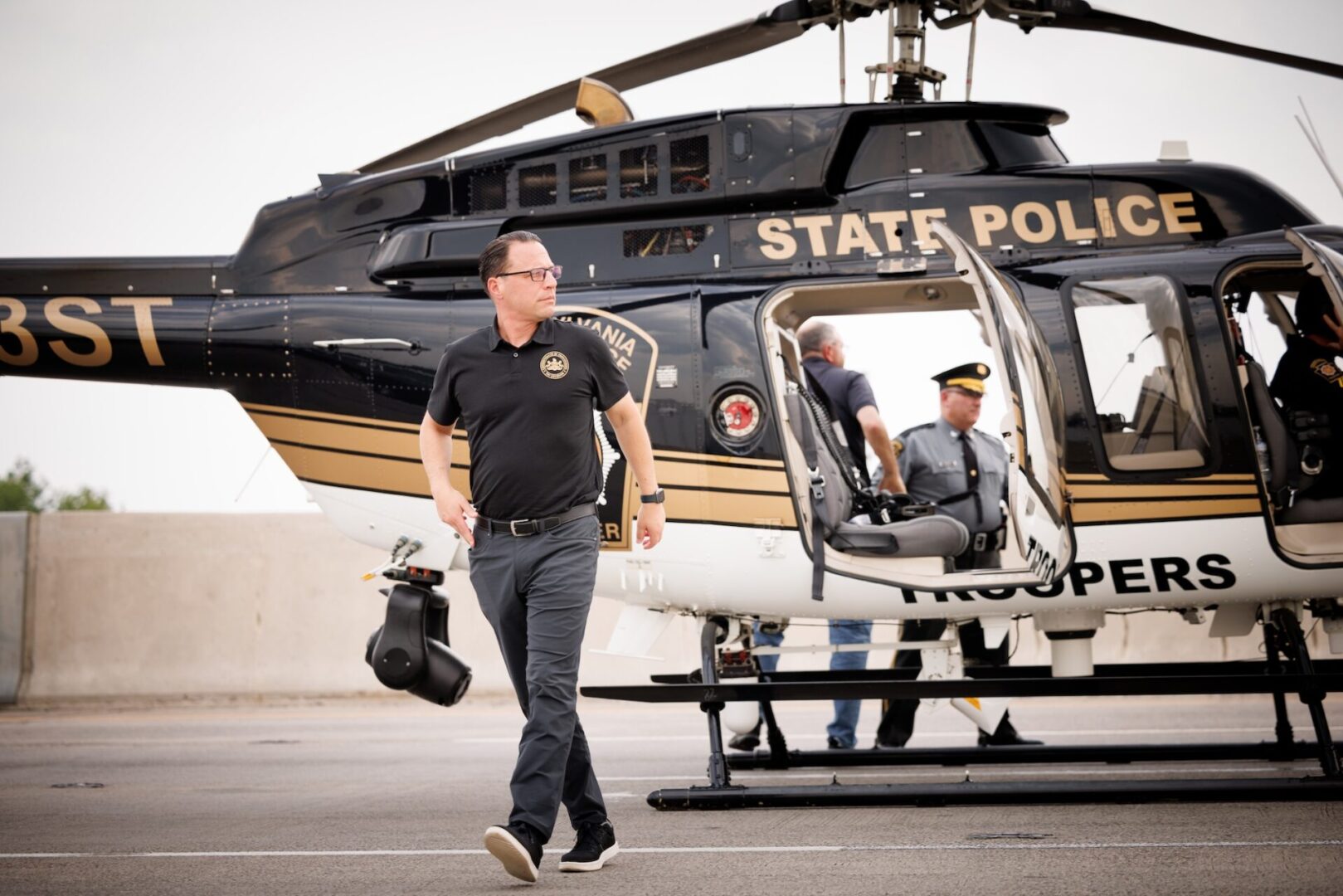 Gov. Josh Shapiro arrives on a state police hellicopter in Philadelphia to discuss a partial Interstate 95 collapse.