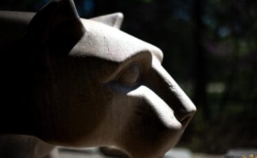 Close up of the Penn State's Nittany Lion Shrine statue in profile