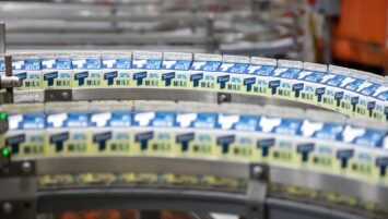 Milk cartons on a production line.
