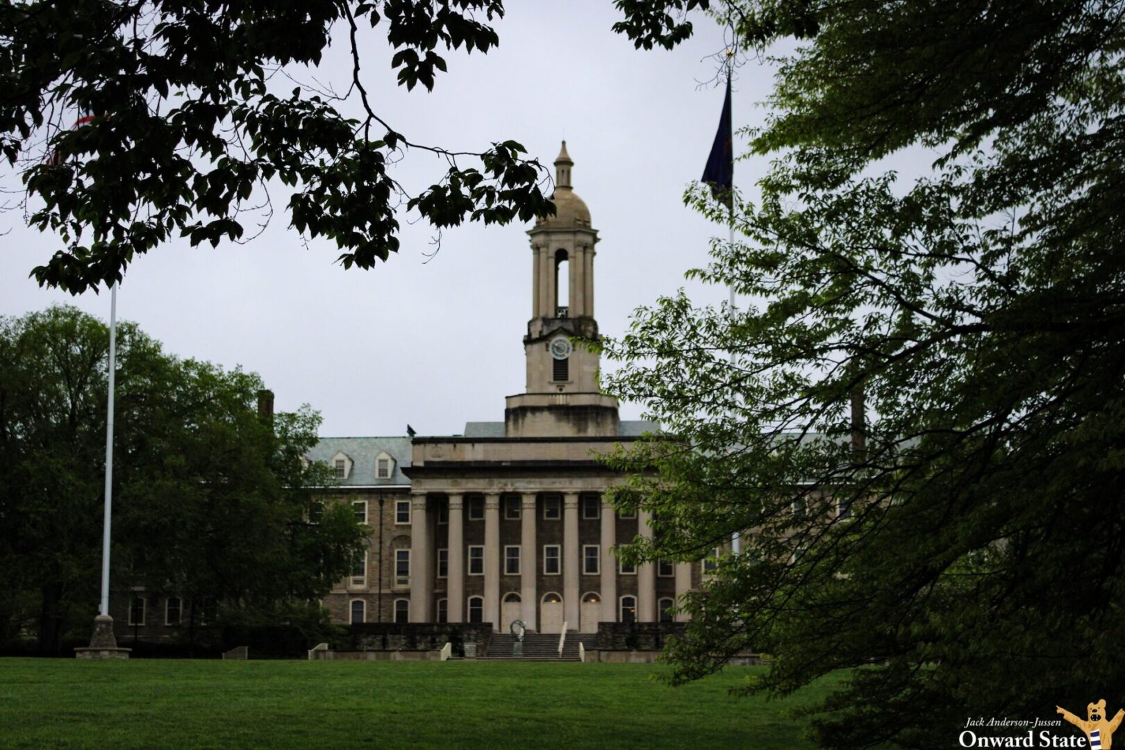 Old Main at Penn State seen through trees on May 9, 2025