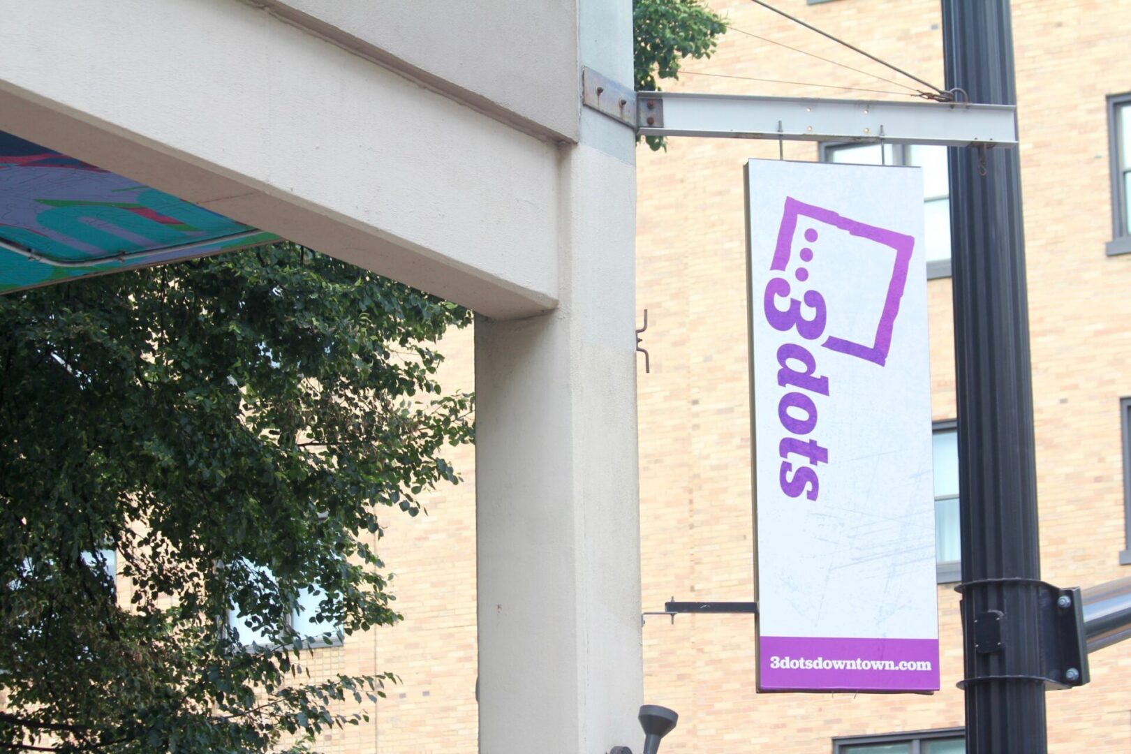 The sign for 3 Dots Downtown in State College is pictured on July 26, 2025