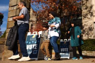 Voters walk past ‘Vote Here’ signs in front of Temple Sinai in the Squirrel Hill neighborhood on Election Day on November 5, 2024 in Pittsburgh, Pennsylvania.