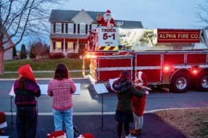 Alpha Fire Company Escorts Santa Claus Around State College for Christmas Eve Tradition
