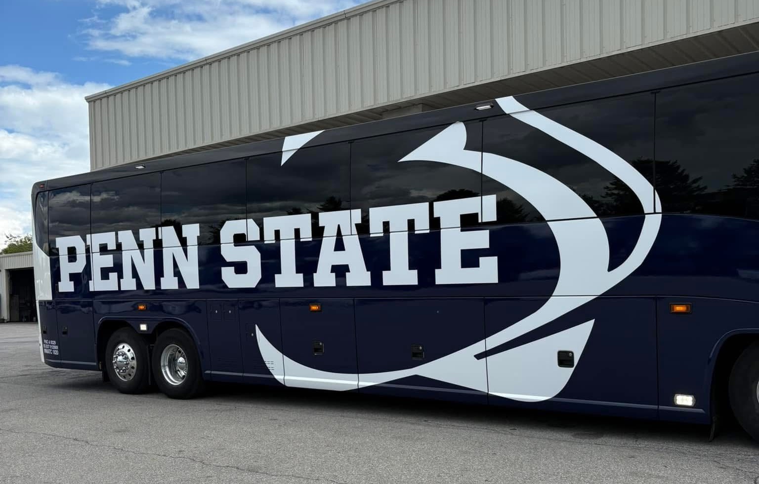 A Fullington Trailways bus wrapped with the Penn State logo