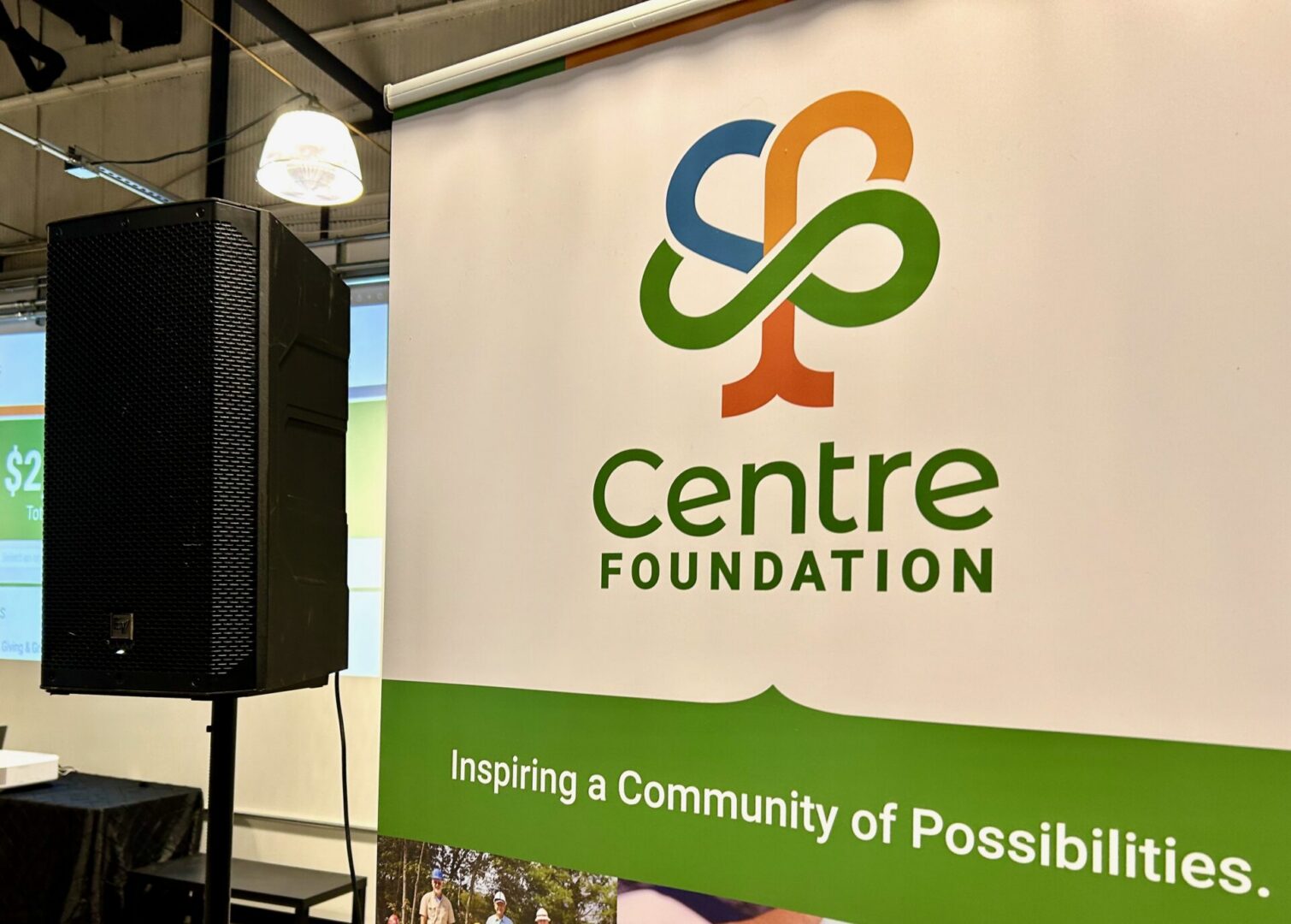 Centre Foundation logo and "Inspiring a community of possibilities on a white and green sign