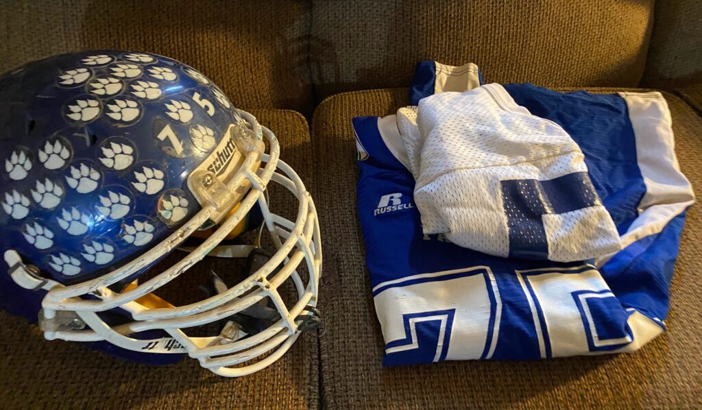 Isaiah Compton's football helmet and jerseys are seen at his parents’ home in Tioga County.