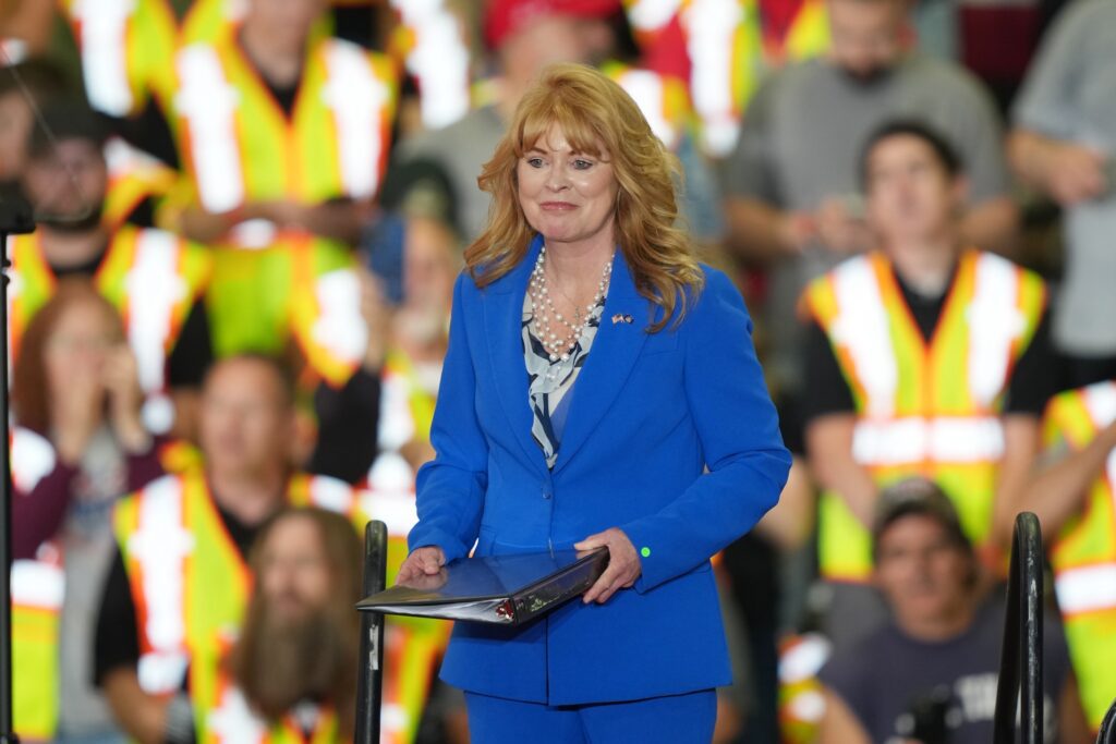 Stacy Garrity walks on stage to speak ahead of President Donald Trump at a Macungie operations facility for Mack Trucks in June, 2026.